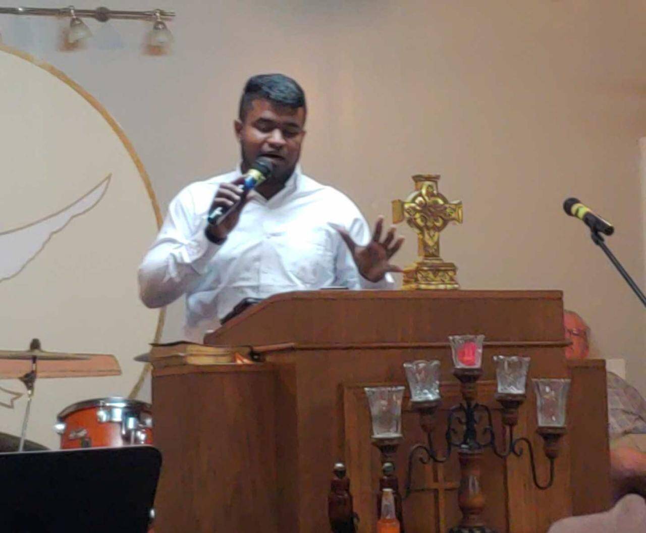 A Christian pastor preaching a sermon on fasting