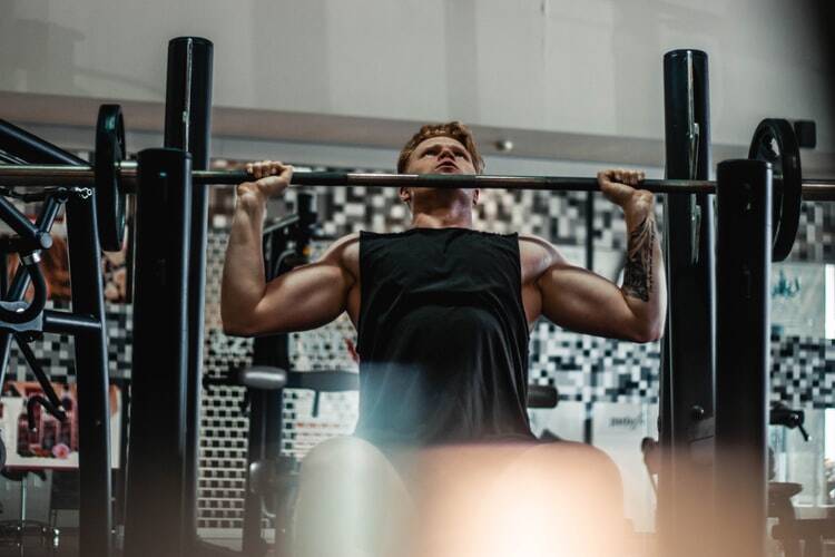 An athlete lifting weights in the gym 