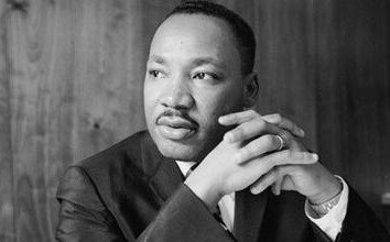 Martin Luther King with folded hands moment before giving a speech 