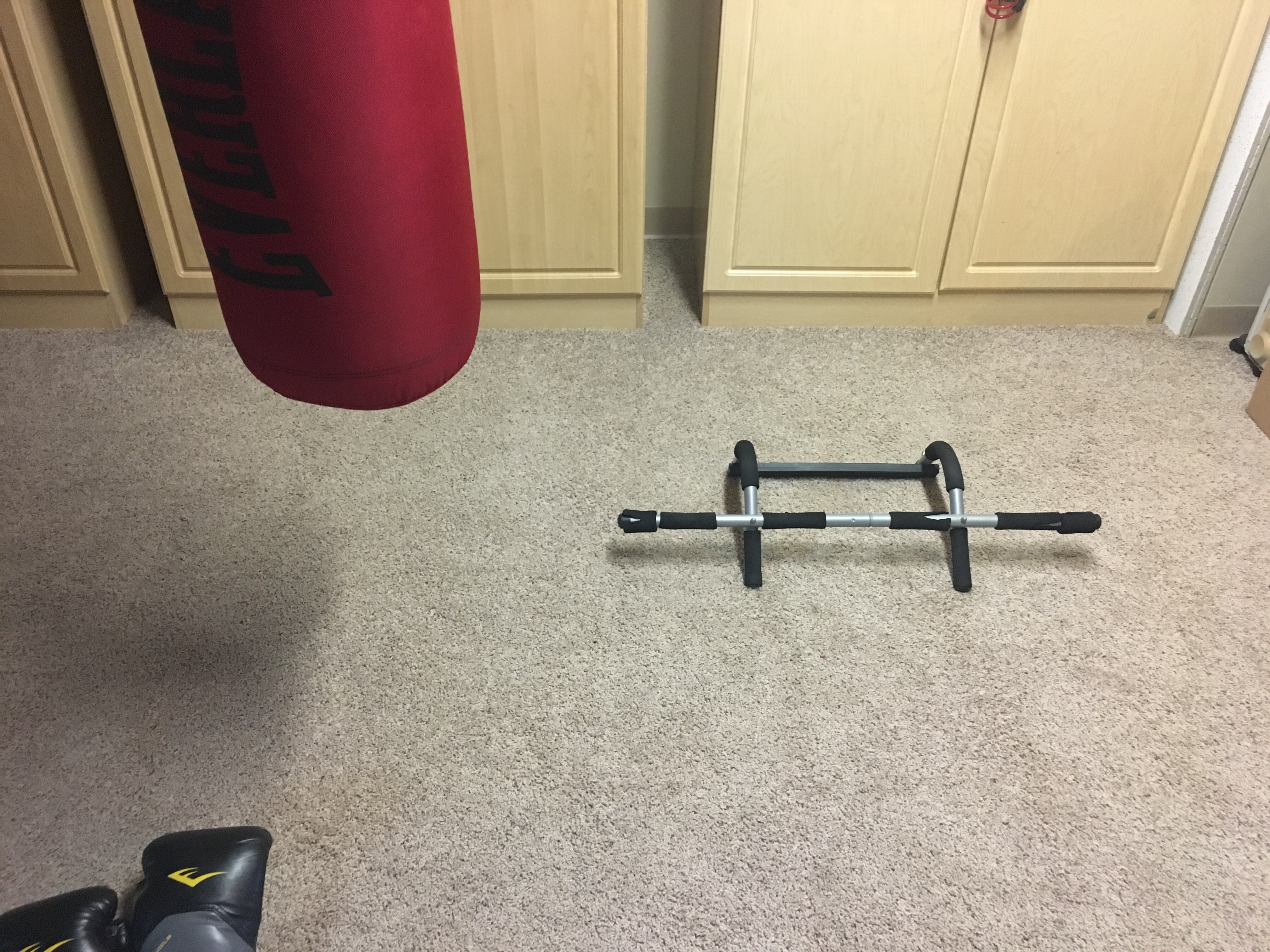Iron gym workout bar in the push-up position