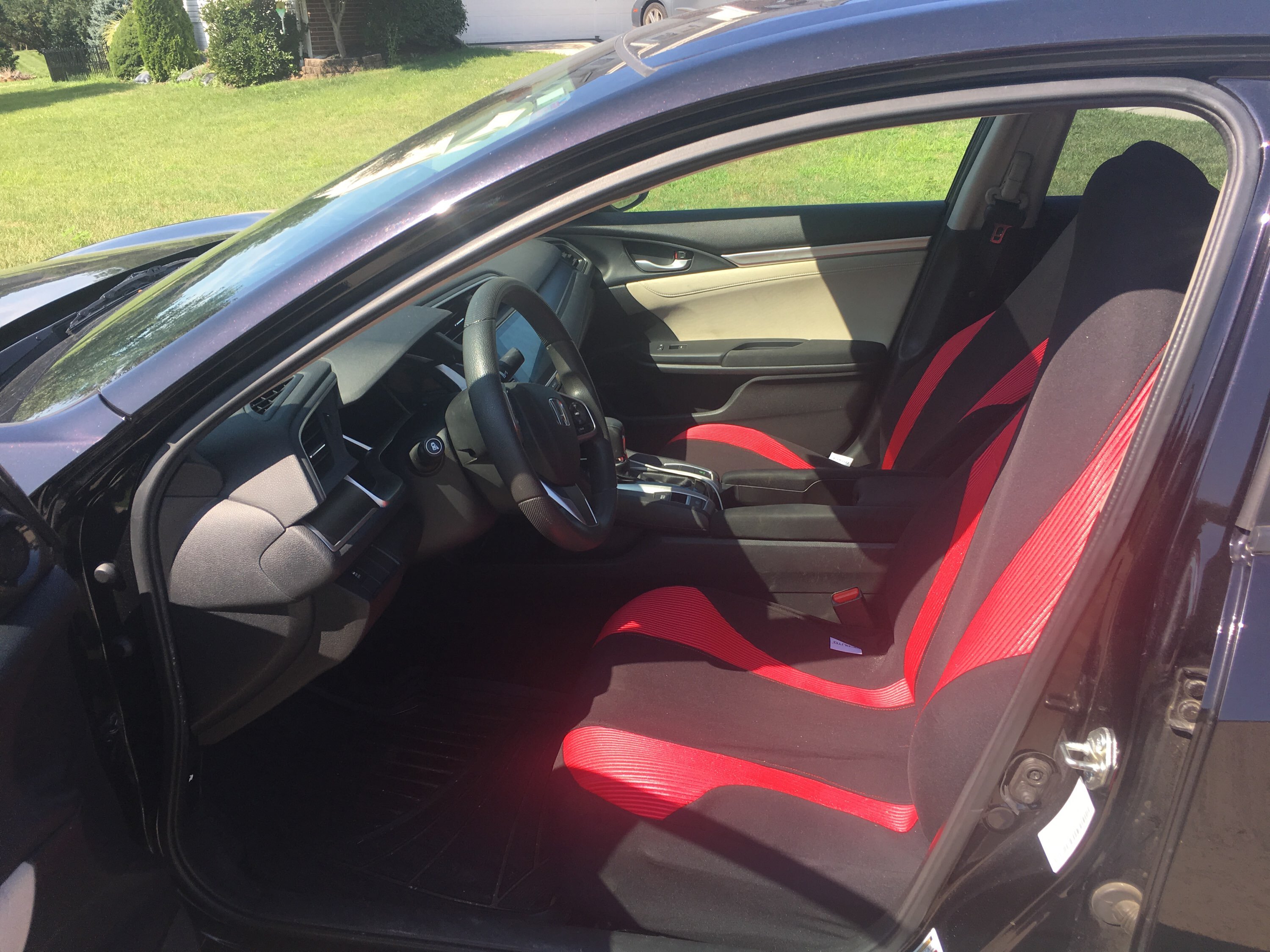 My Honda Civic shown with red and black seat covers