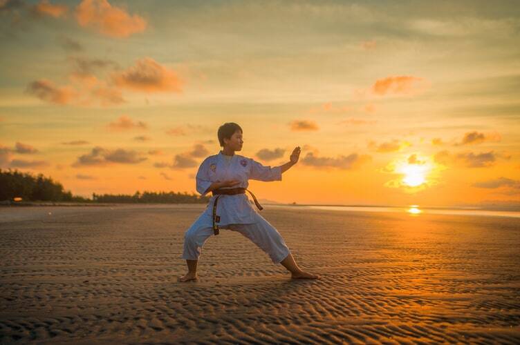 A boy practicing martial arts to become a man