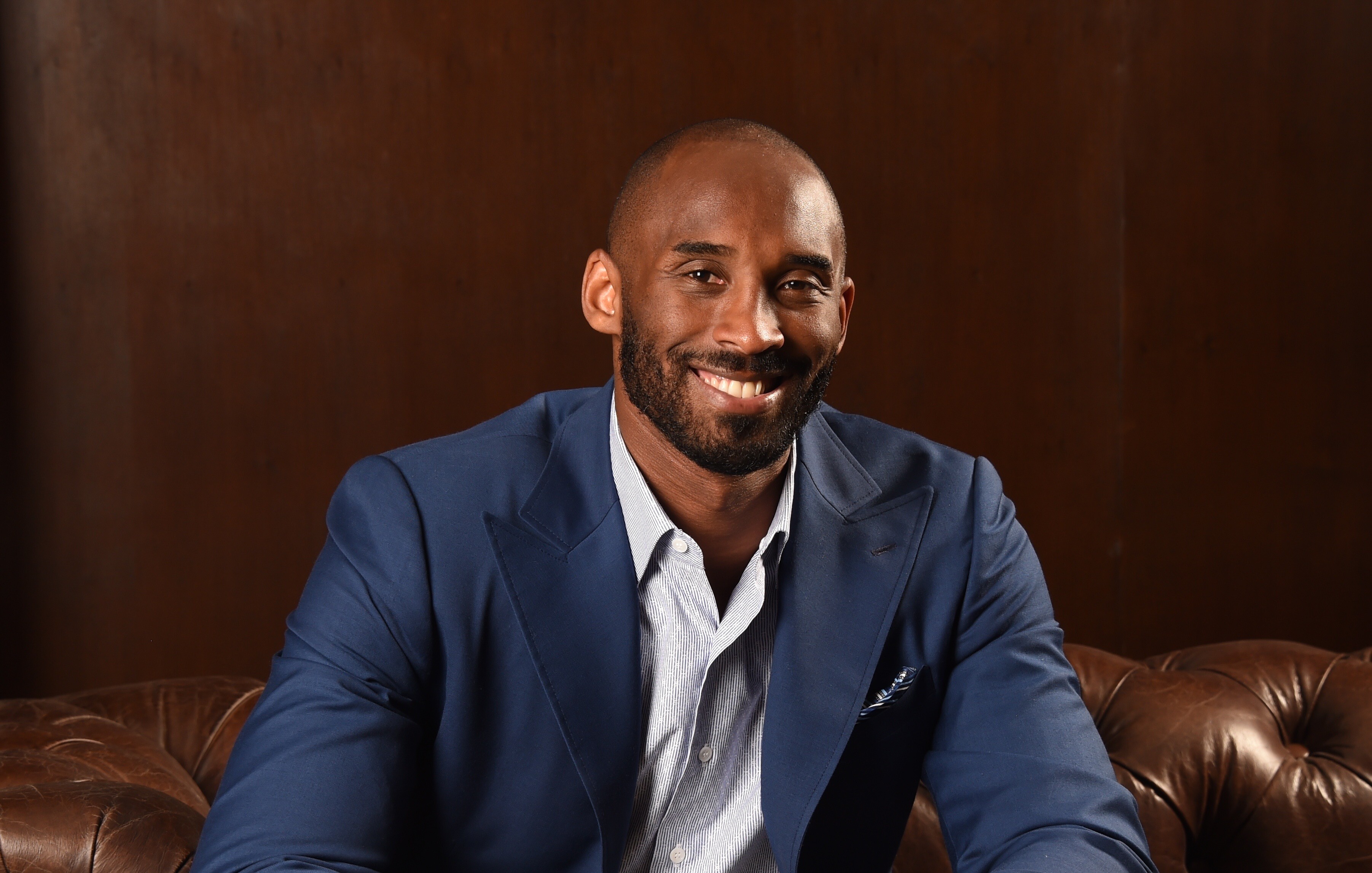 A smiling Kobe Bryant talking about success