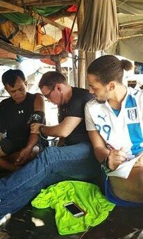 Devin and Patrick conducting free medical screenings in Phnom Penh, Cambodia.