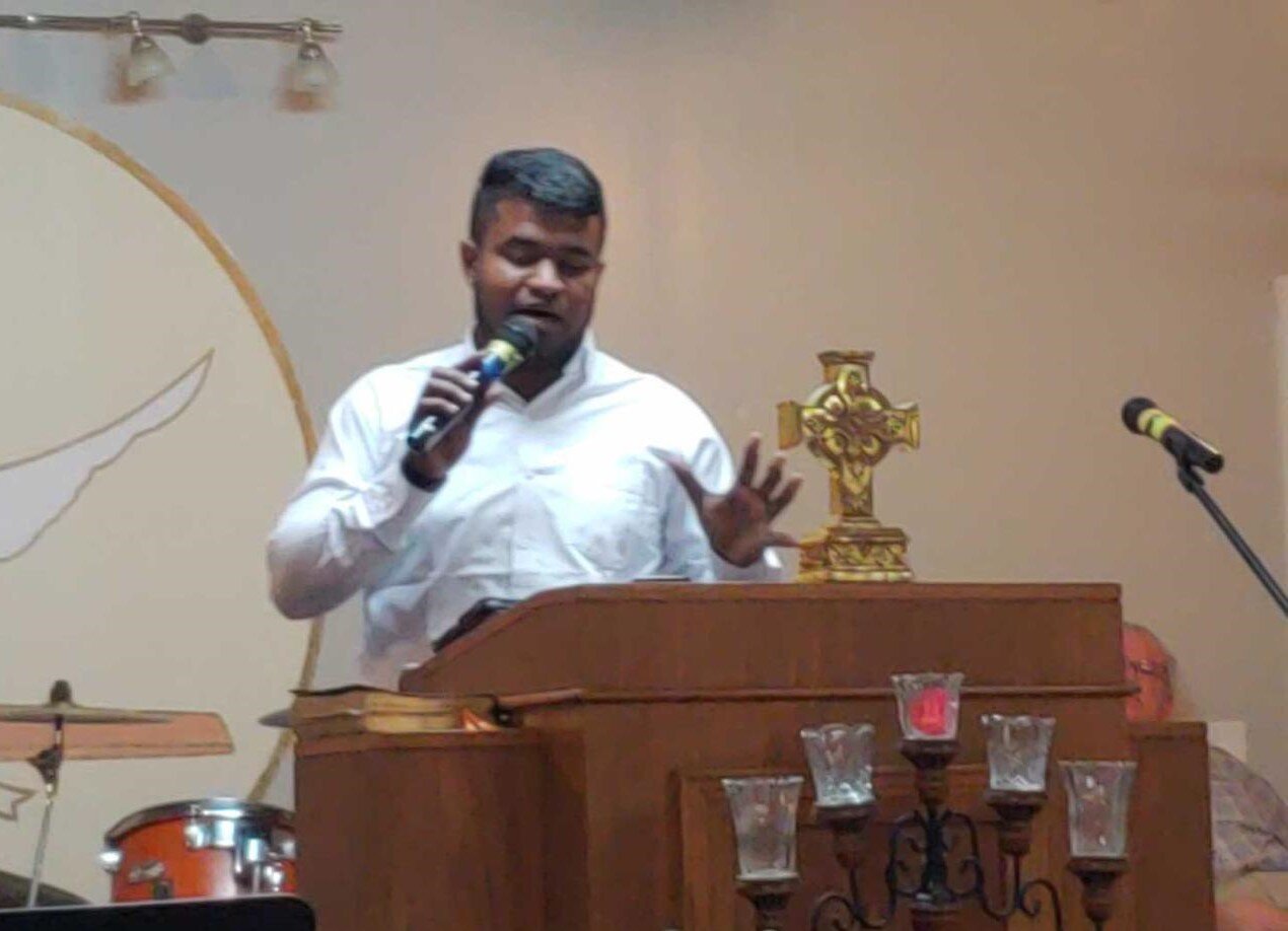 A Christian pastor preaching a sermon on fasting